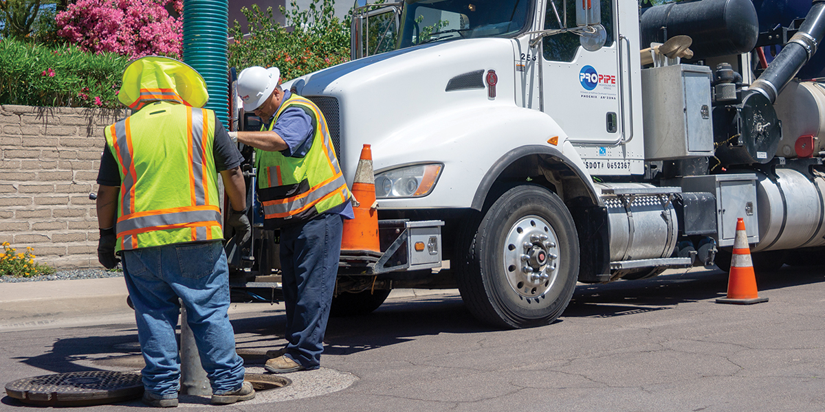pro pipe team inspecting manhole